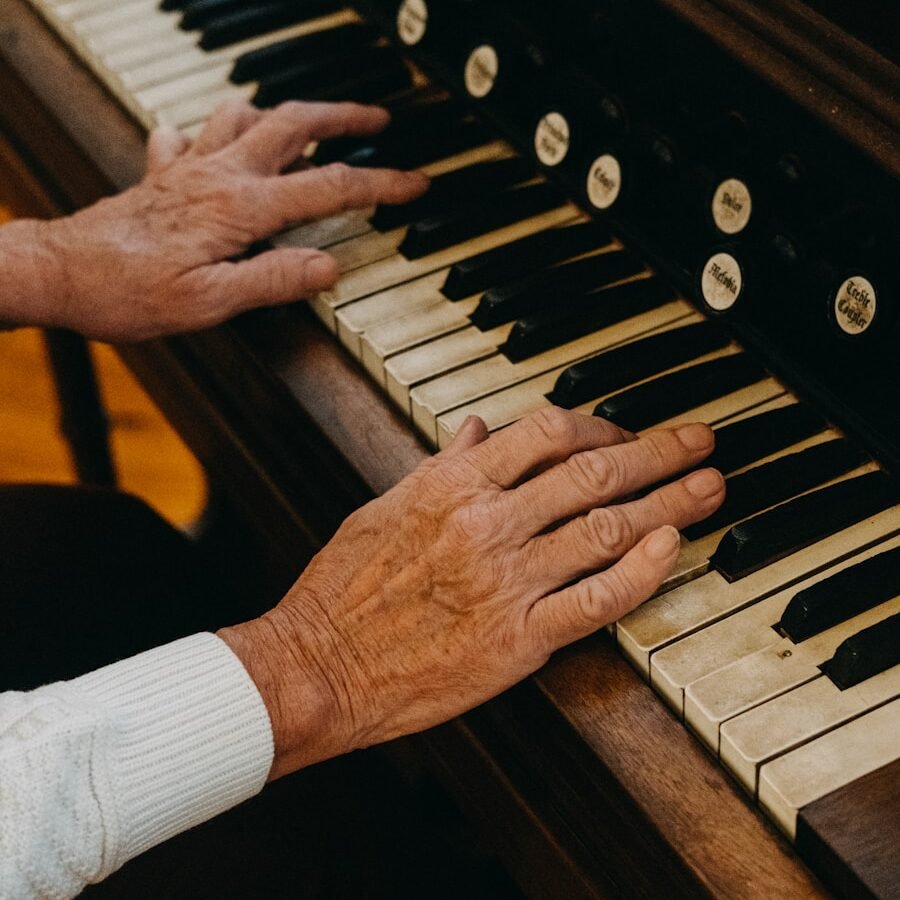 person playing piano during daytime